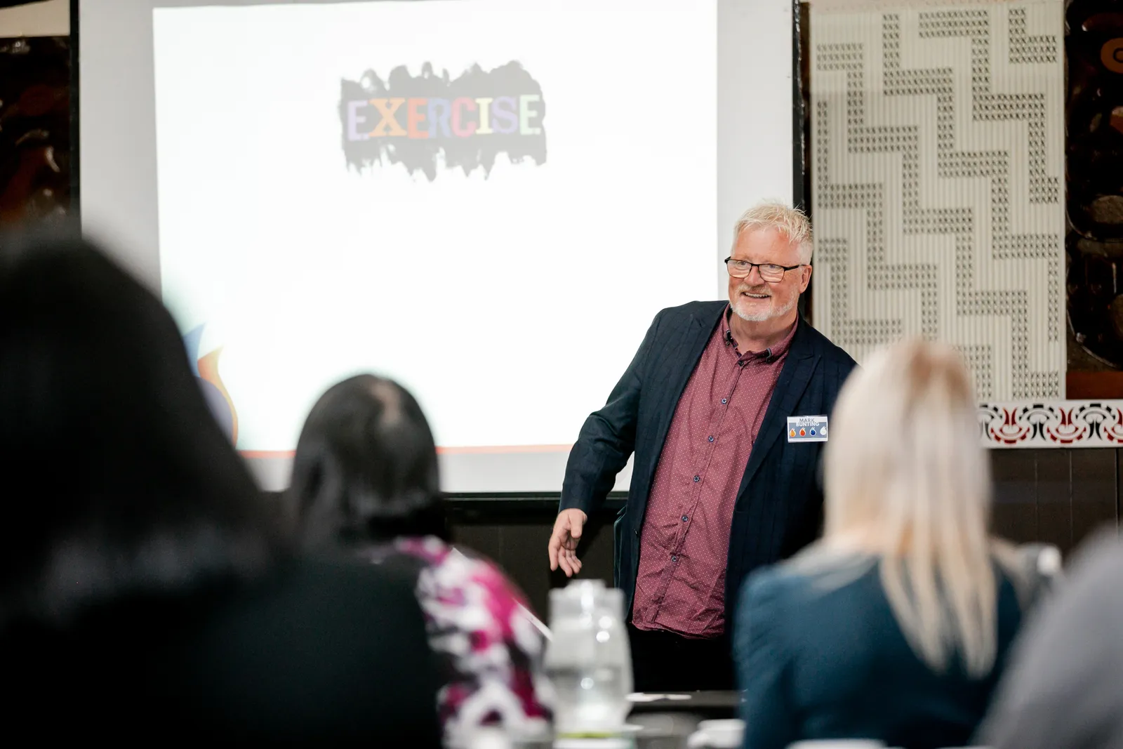 Mark presenting to a room during a workshop